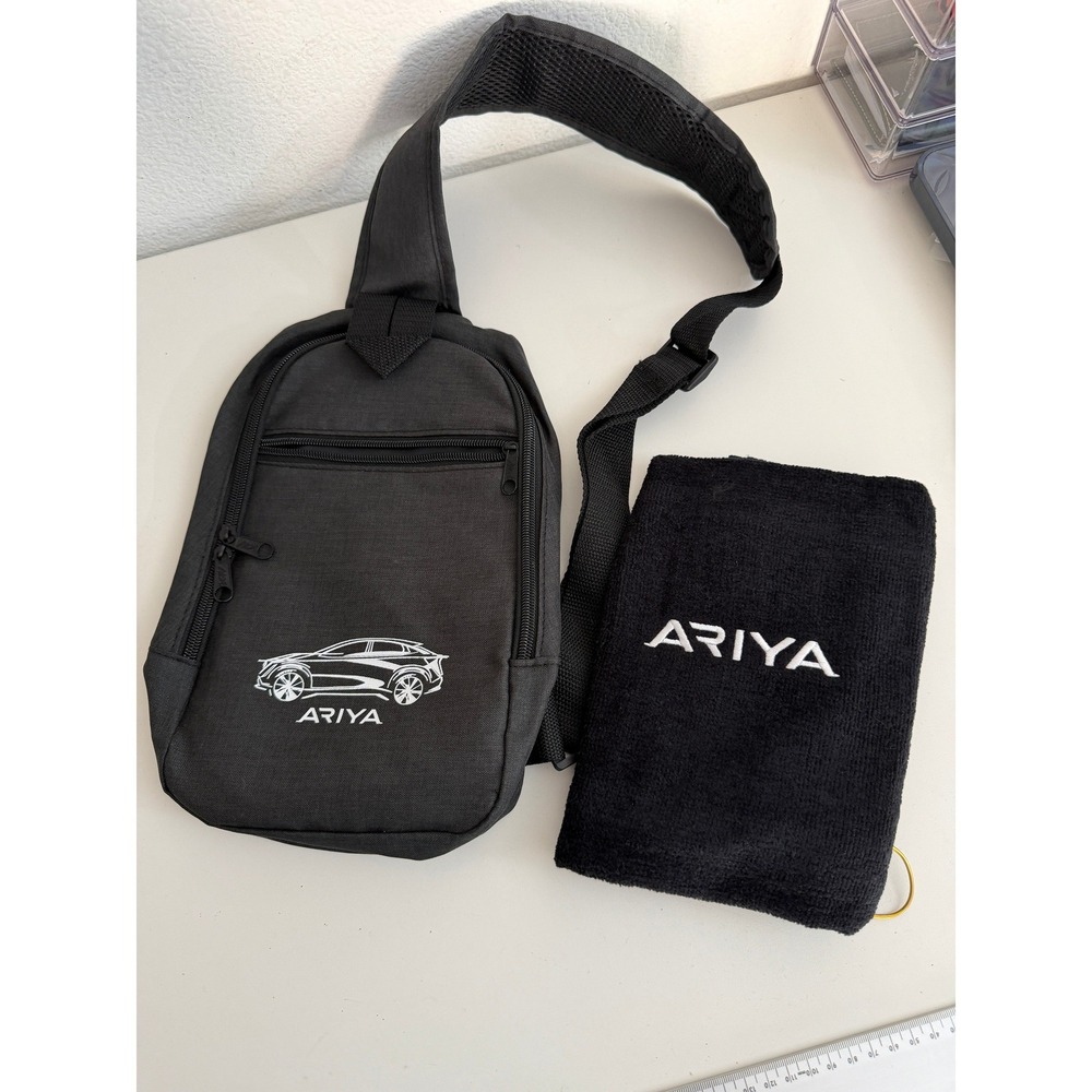 Nissan Ariya Black Sling Bag Backpack and Embroidered Golf Towel Set EV Promo